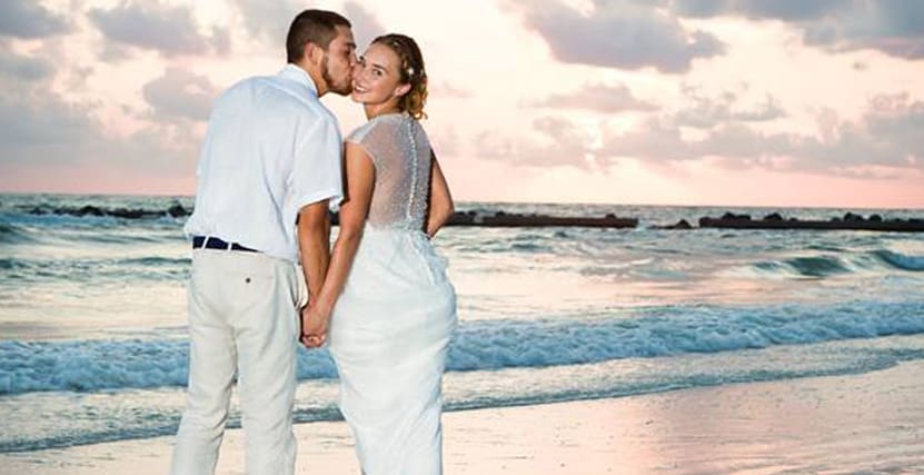 Couple Kissing on Honeymoon Island at Sunset